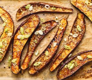 Miso Eggplant on a tray with sesame and scallions