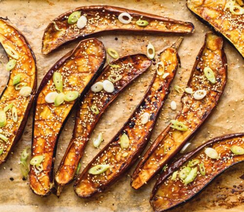 Miso Eggplant on a tray with sesame and scallions