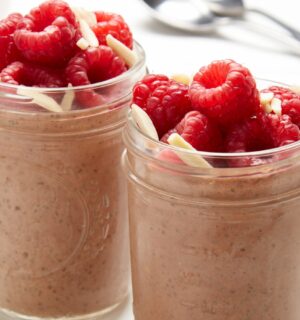 raspberry, chocolate, and almond chia pudding with almond butter, cocoa powder, and bright fruit