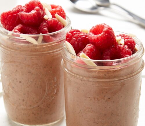 raspberry, chocolate, and almond chia pudding with almond butter, cocoa powder, and bright fruit