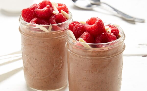 raspberry, chocolate, and almond chia pudding with almond butter, cocoa powder, and bright fruit