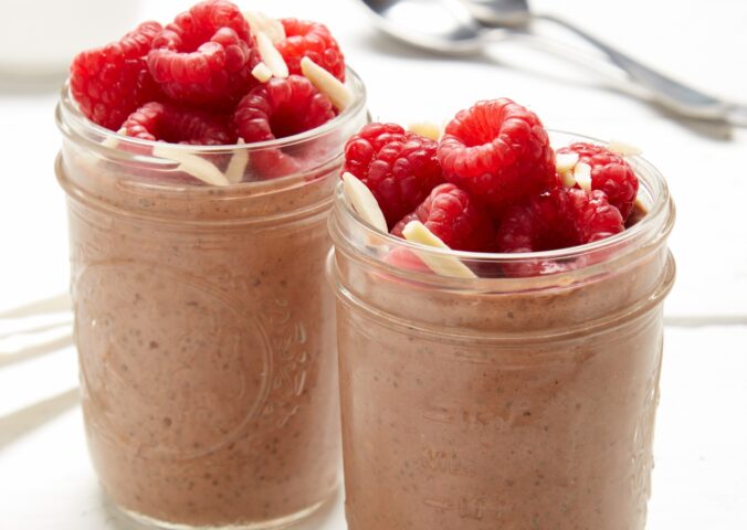 raspberry, chocolate, and almond chia pudding with almond butter, cocoa powder, and bright fruit