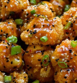 Spicy Sesame Cauliflower Wings with a sauce and green onion for vegan sesame recipes