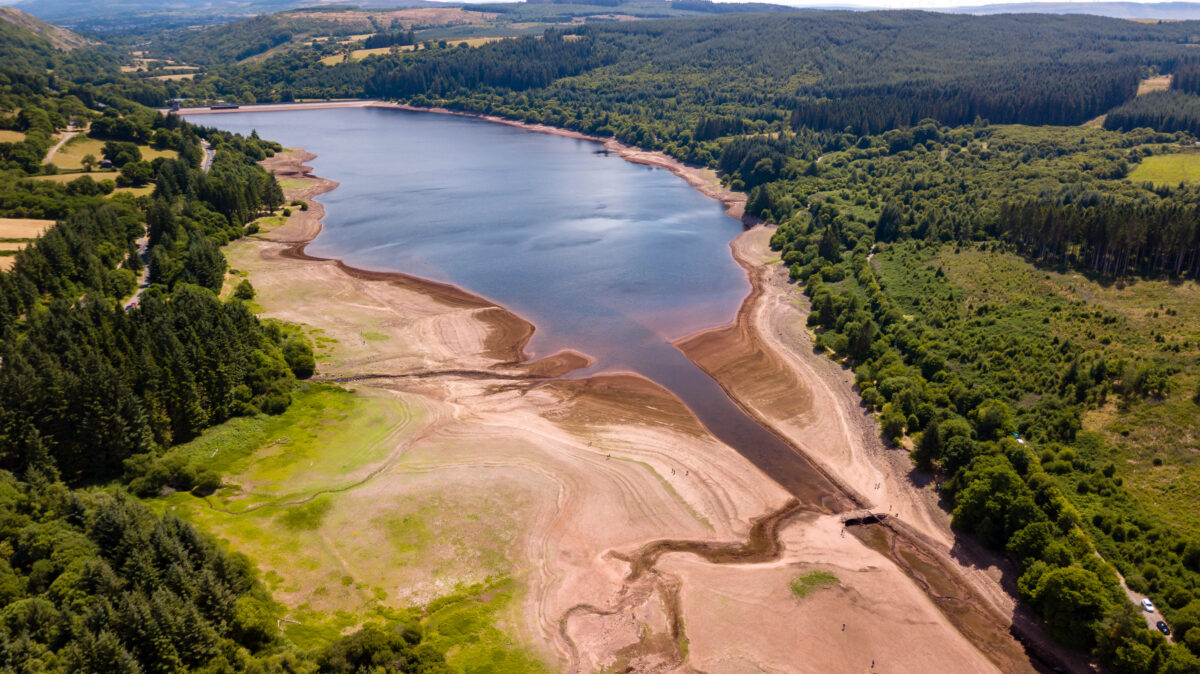 Photo shows the Llwyn-On Reservoir in Wales with low water during a heatwave. According to new analysis, just two of the UK’s planned AI datacenters will emit more carbon than ExxonMobil, the second-largest fossil fuel company in the world