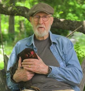 Photo shows vegan actor James Cromwell holding Hermione, a rescued hen. Cromwell appears in a new campaign video for PETA, in which he debunks the cage-free “lie” and encourages people to eat vegan eggs