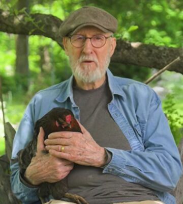 Photo shows vegan actor James Cromwell holding Hermione, a rescued hen. Cromwell appears in a new campaign video for PETA, in which he debunks the cage-free “lie” and encourages people to eat vegan eggs