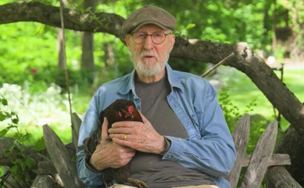 Photo shows vegan actor James Cromwell holding Hermione, a rescued hen. Cromwell appears in a new campaign video for PETA, in which he debunks the cage-free “lie” and encourages people to eat vegan eggs