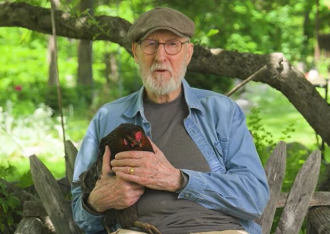 Photo shows vegan actor James Cromwell holding Hermione, a rescued hen. Cromwell appears in a new campaign video for PETA, in which he debunks the cage-free “lie” and encourages people to eat vegan eggs