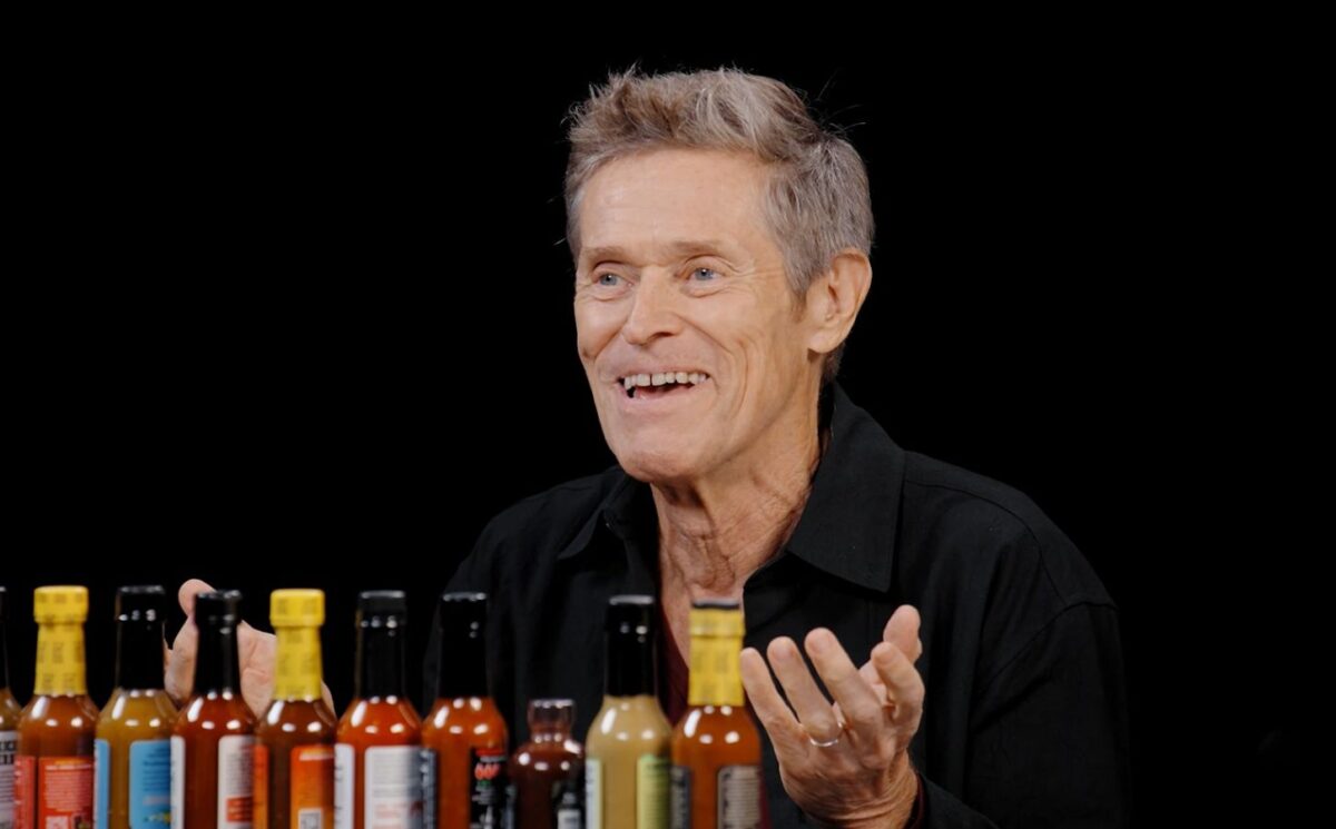 Photo shows Willem Dafoe during his recent appearance on the YouTube talk show 'Hot Ones,' where he chose to eat vegan chicken nuggets. The celebrated actor does not follow a vegan diet, but has said on multiple occasions that he doesn’t eat meat