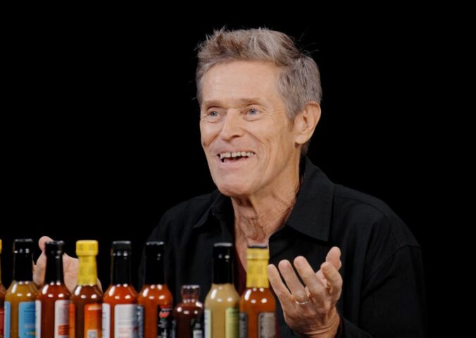 Photo shows Willem Dafoe during his recent appearance on the YouTube talk show 'Hot Ones,' where he chose to eat vegan chicken nuggets. The celebrated actor does not follow a vegan diet, but has said on multiple occasions that he doesn’t eat meat