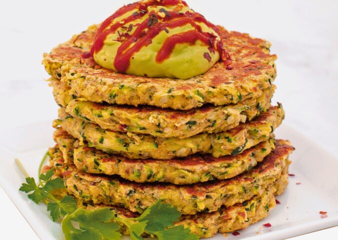 Quick And Crispy Zucchini Fritters With Avocado Crema