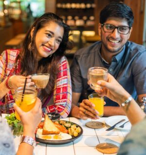 Photo shows a group of young Indian friends eating at a cafe. New research has found that most consumers in urban India would buy cultivated meat