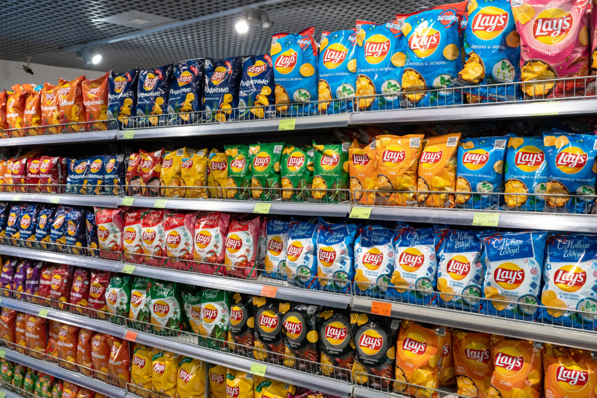 Photo shows the crisp section in a European supermarket, including several different flavors of Lay's. Crisps with “meaty” names and flavors like roast chicken could soon be caught up in the EU’s controversial plant-based labeling ban