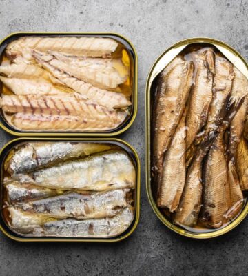 Photo shows three tins of fish. Tinned fish sold in UK supermarkets as "mackerel" may not actually contain any true mackerel