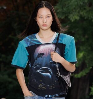 Photo shows a model wearing an ocean-inspired top on the runway at a recent fashion show by designer Stella McCartney, who said, “Sea life, not sea food."